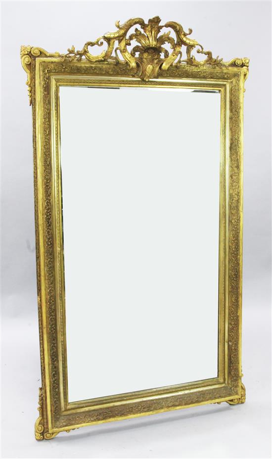 An early 20th century French gilt gesso wall mirror, W.3ft H.5ft 2in.